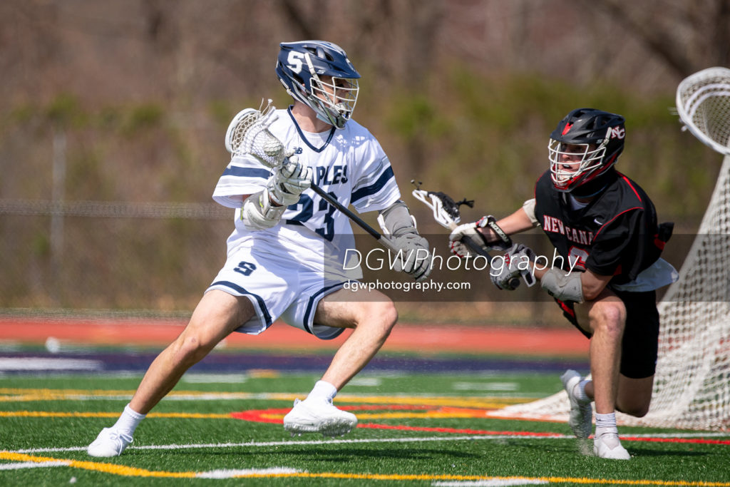 Aidan Best of Staples High looks to score one of his two goals against New Canaan Saturday.