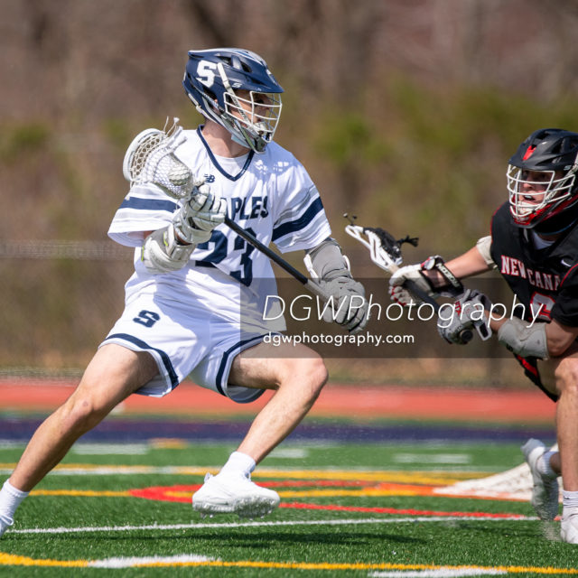 Aidan Best of Staples High looks to score one of his two goals against New Canaan Saturday.