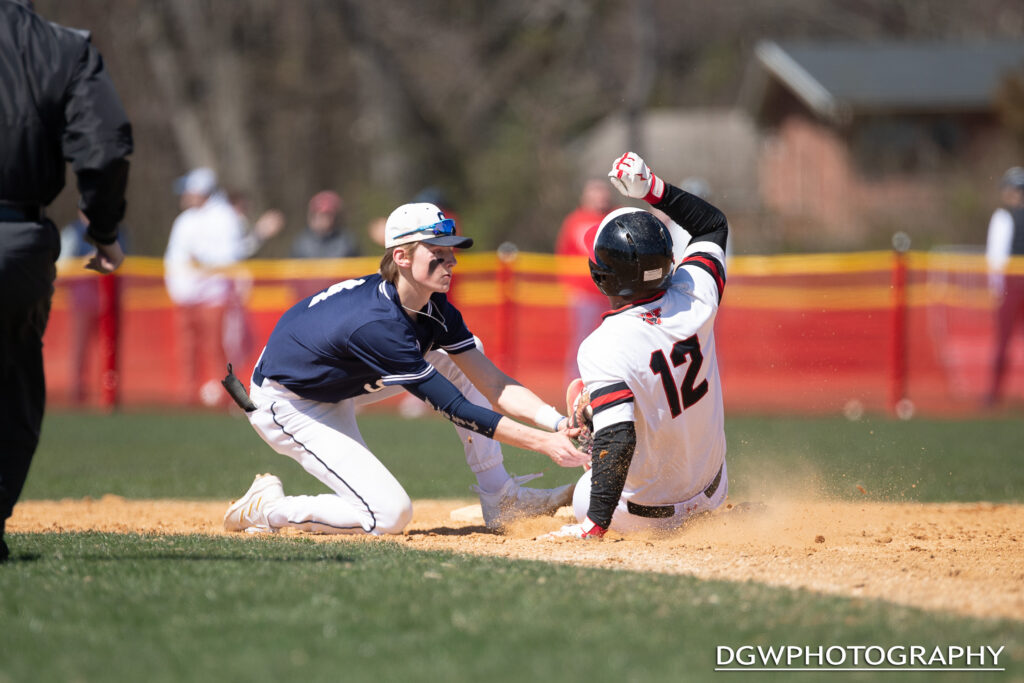 Staples' Andrew Oppenheimer tags out Fairfield Warde's Jimmy Dobbs trying to steal second.