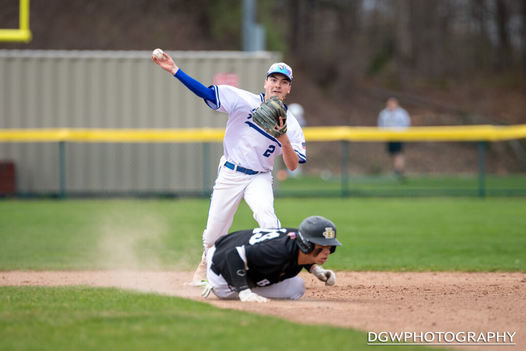 Newtown High second baseman  Jonathan Moseman completes a double play against Joel Barlow on Friday.