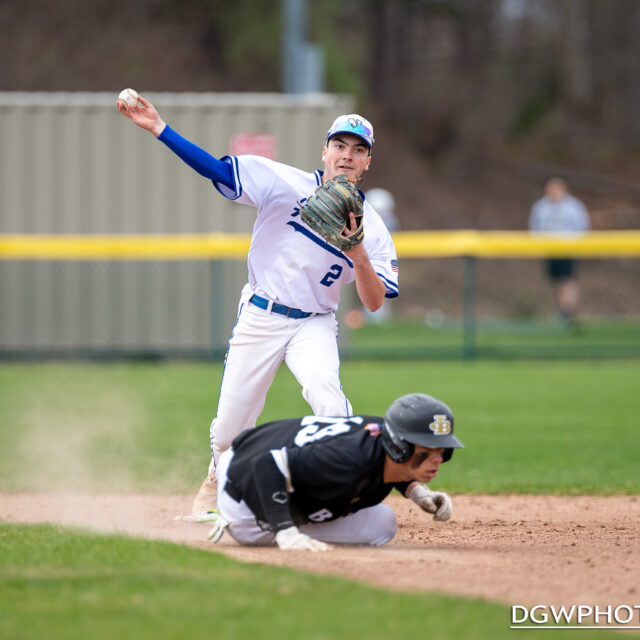 Newtown High second baseman Jonathan Moseman completes a double play against Joel Barlow on Friday.