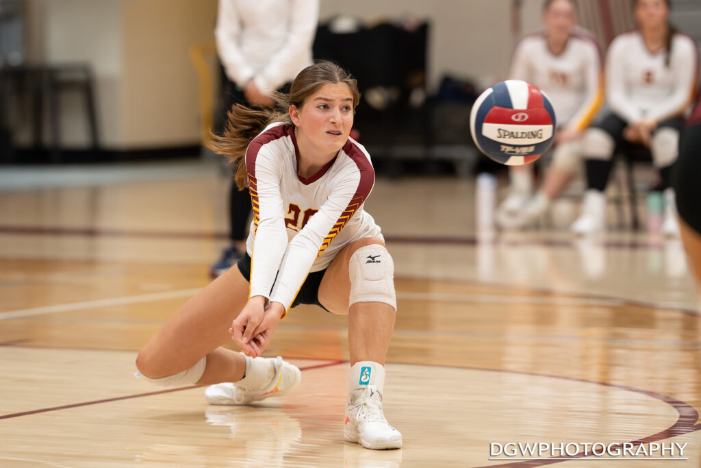 St. Joseph's Sarah Lovett goes low to dig one out against Greenwich High Monday night.