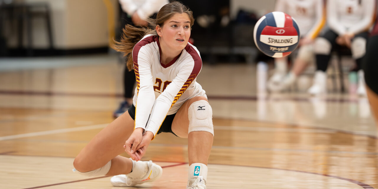 St. Joseph's Sarah Lovett goes low to dig one out against Greenwich High Monday night.