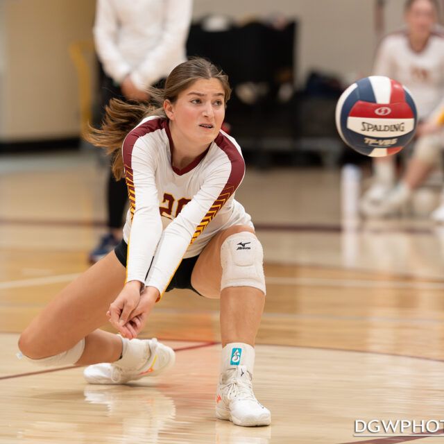 St. Joseph's Sarah Lovett goes low to dig one out against Greenwich High Monday night.